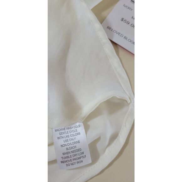 Sunny Leigh Ivory Knotted Front Sleeveless Top - Picture 6 of 6